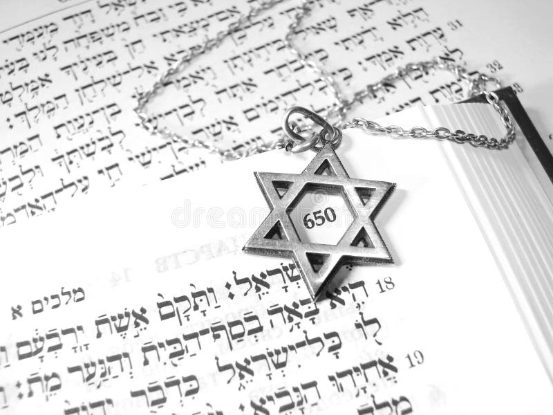 Jewish religious symbols - star of David, Torah hebrew, yarmulke - closeup. Jewish religious symbols - star of David, Torah hebrew, yarmulke - closeup.