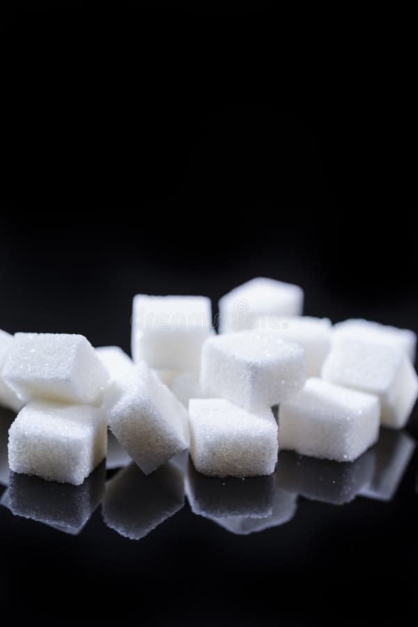 Macro Shoot of White Cube Sugar Placed Bulk Against Black Background