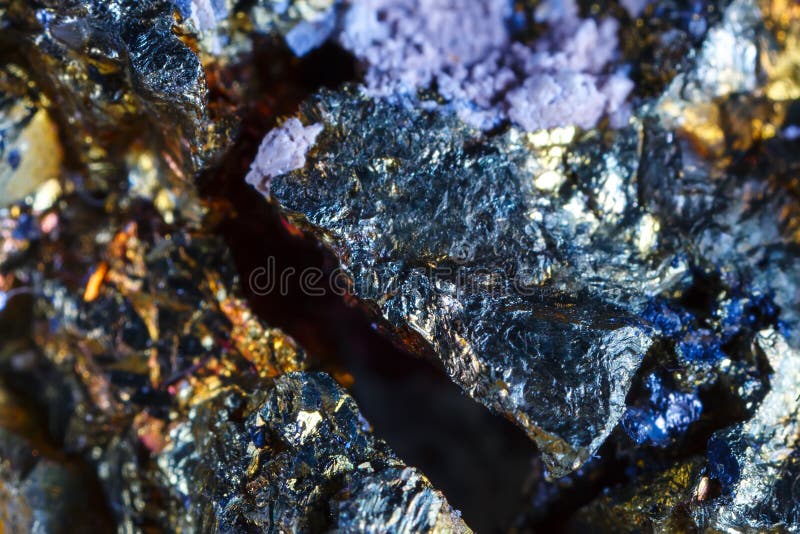 Macro shooting of natural gemstone. The raw mineral is chalcopyrite . The texture of the stone. Abstract background.