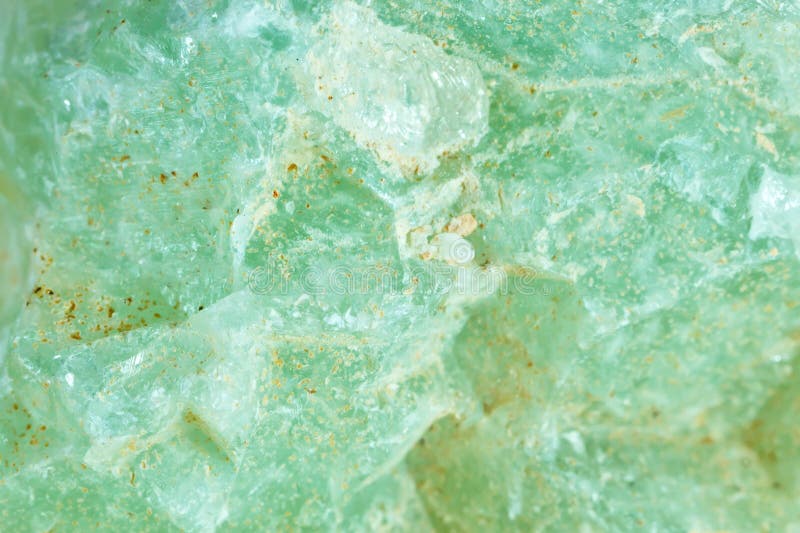 Macro shooting of natural gemstone. The texture of mineral prenit. Abstract background.