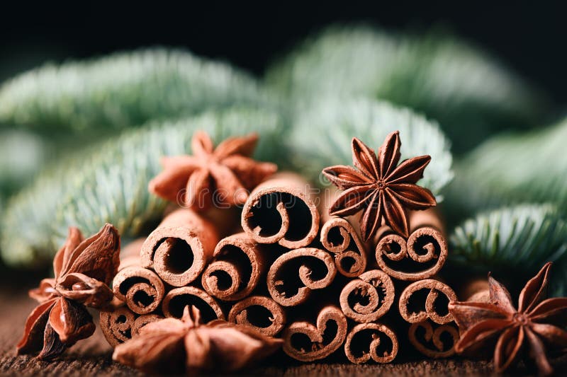 Macro shot of anise stars and heap of cinnamon sticks royalty free stock photography