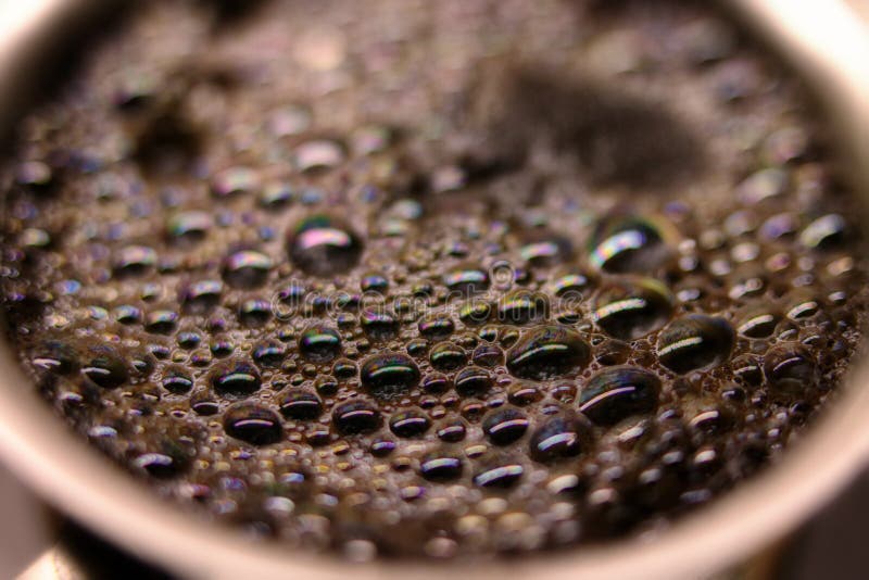 Macro Shot of Brewed Coffee in a Round Cup Sparkles Stock Photo Image