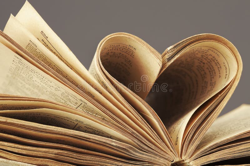 Macro shot of heart in old book