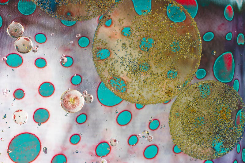 Macro shot of oil bubbles over colored background stock photography Macro shot of oil bubbles over colored background stock photography