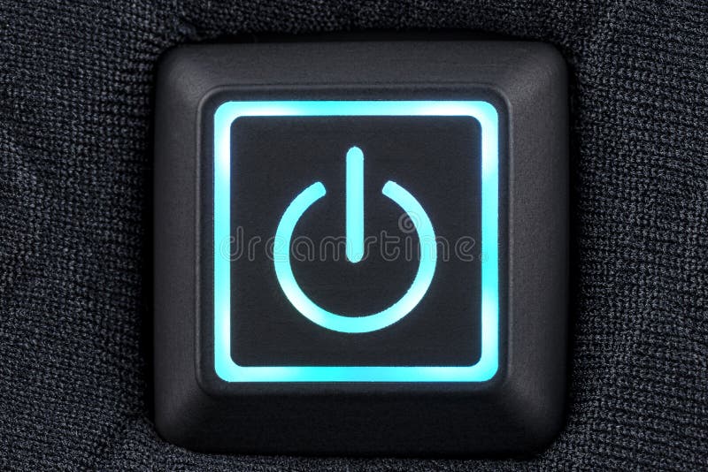 Macro shot of a plastic button with a turquoise power symbol, sewn into modern clothing, top view. Macro shot of a plastic button with a turquoise power symbol, sewn into modern clothing, top view