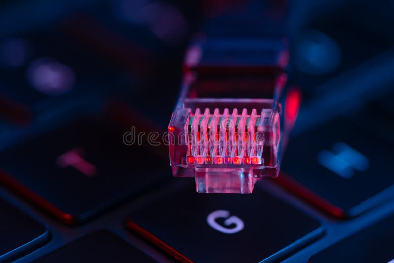 Macro shot view of internet switch on a laptop keyboard with neon lights. Close-up view. Concept of modern technology..
