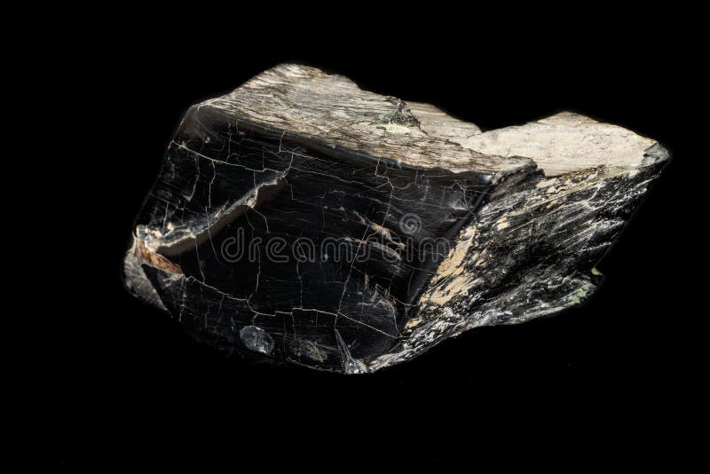 Macro Stone Mineral Jet Lignite on a Black Background Stock Image