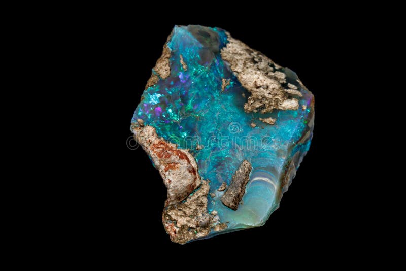 Macro stone Opal mineral in rock on a black background stock image