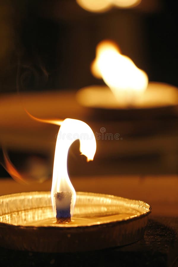 Burning tea light candles stock photo. Image of religious 30101772
