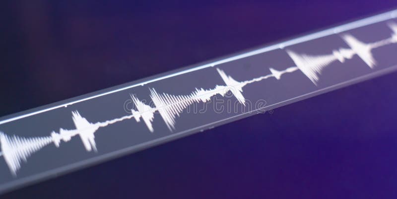A macro view of the computer monitor screen with sound audio wave graph volume stock image