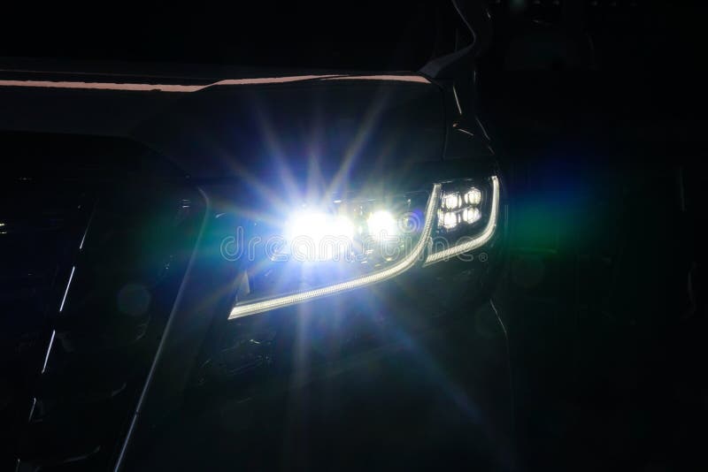 Macro view of modern black car xenon lamp headlight 15
