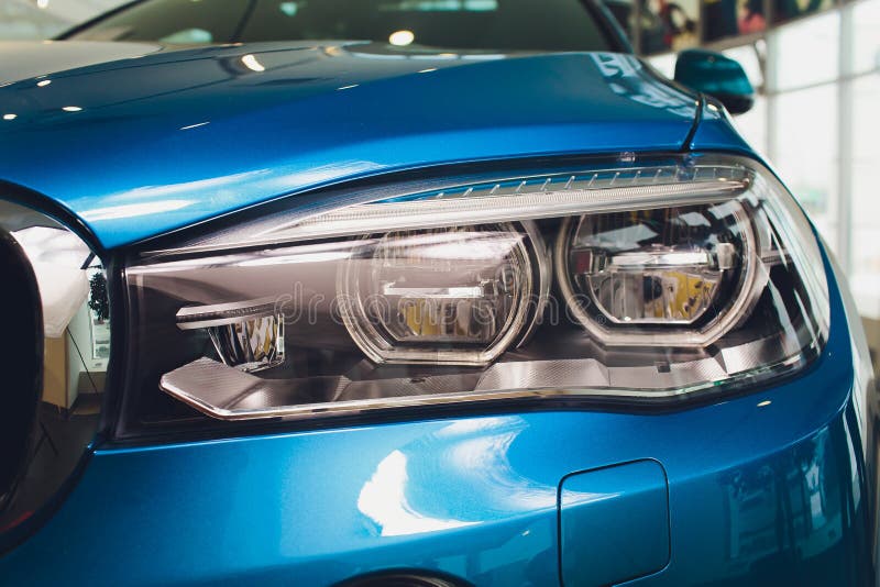 Macro View of Modern Blue Car Xenon Lamp Headlight. Stock Photo Image of transport, head