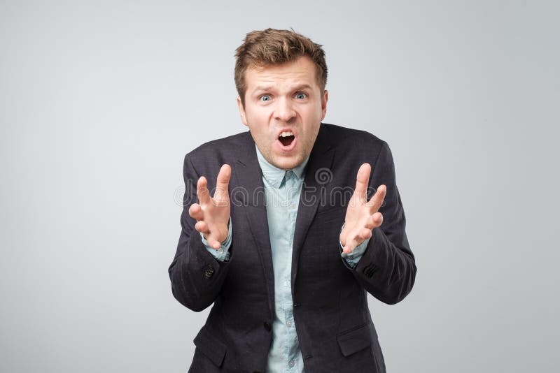 Mad business man or employee screaming, being upset about situation, outcome of his case, isolated white background. Negative human emotions, facial expressions