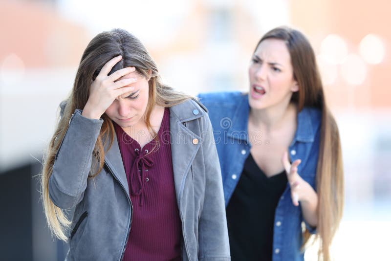 Mad girl scolding her concerned friend stock image Mad girl scolding her concerned friend stock image