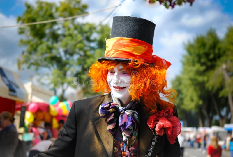 Mad hatter from the tale of Lewis Carroll Alice in Wonderland on the fest, bright colorful character