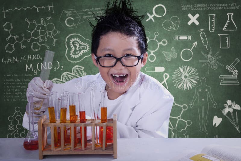 Mad little scientist doing experiment with chemical fluid and looking at camera. Mad little scientist doing experiment with chemical fluid and looking at camera