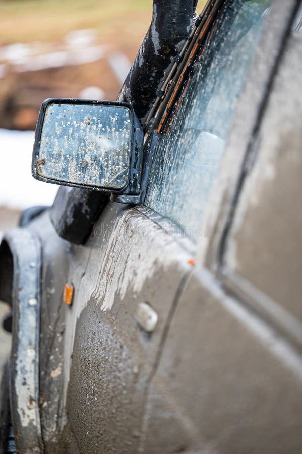 Dirty car side. Splash and texture of mud on a car. Mad splattered 4x4 SUV royalty free stock photo