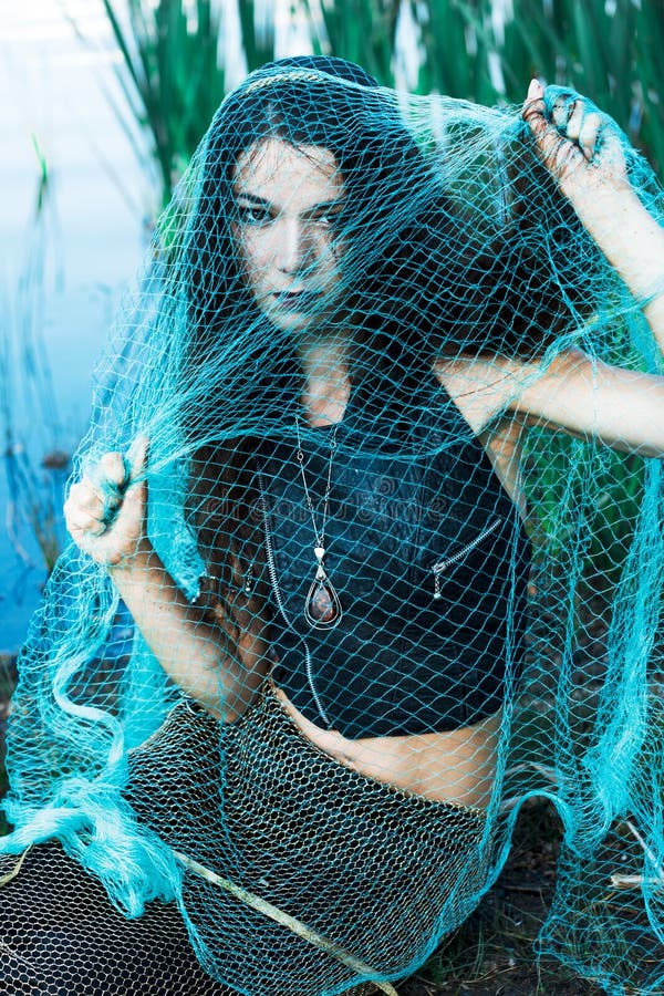 Mad woman mermaid in green net