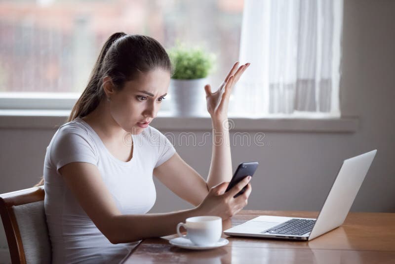 Mad woman annoyed by having problems with smartphone