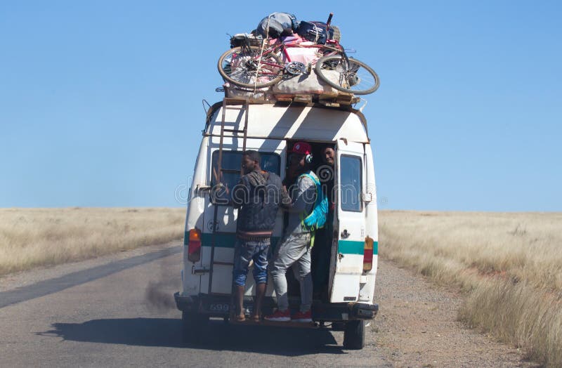 Overloaded bus moves through the vastness of the island of Madagascar