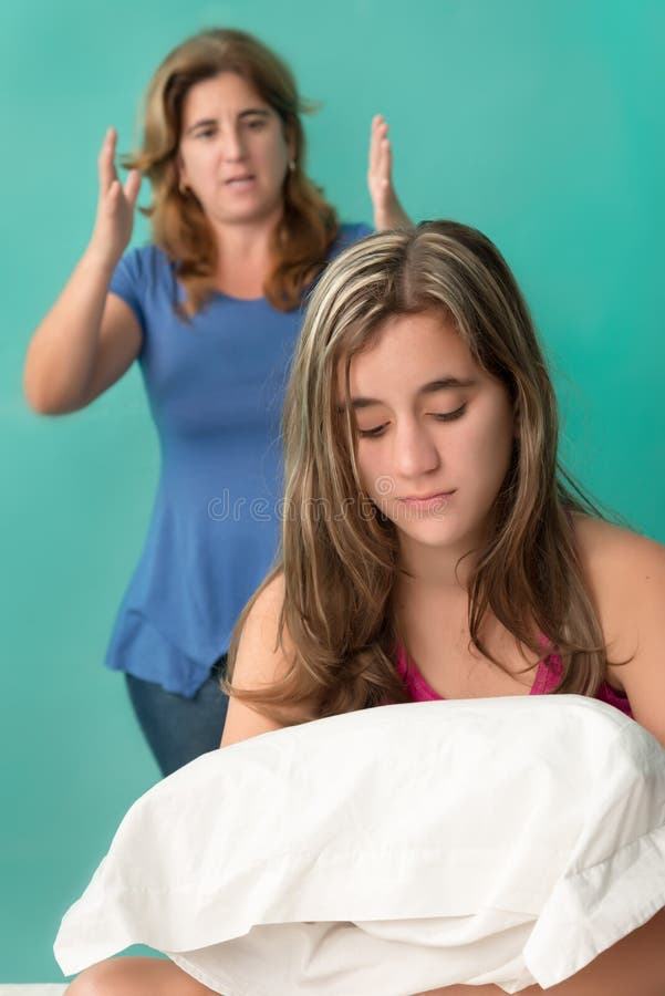 Mother yelling at her defiant teenage girl. Mother yelling at her defiant teenage girl