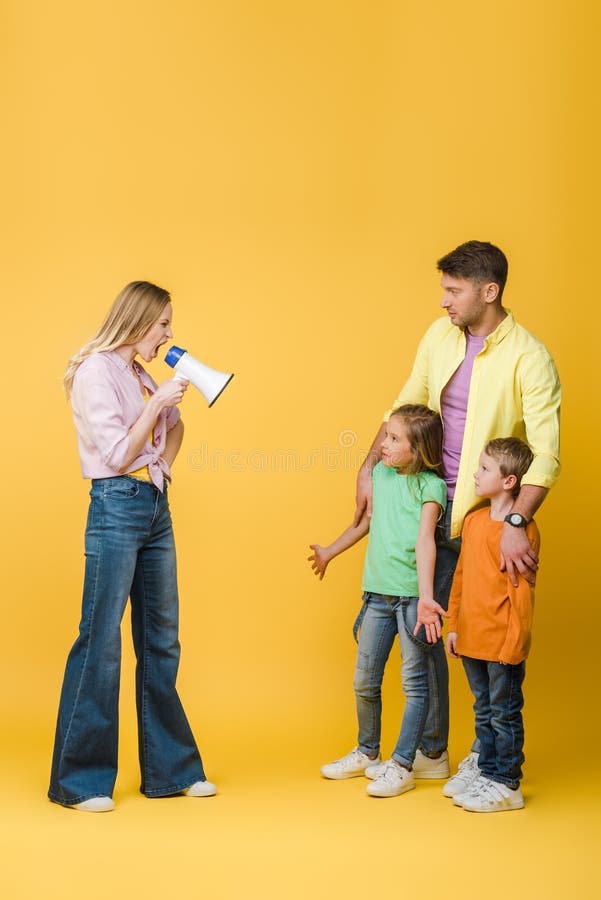 Angry mother yelling into megaphone on confused kids and husband on yellow. Angry mother yelling into megaphone on confused kids and husband on yellow