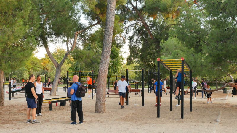 Madrid, Spain - Oct 2019: People having Physical exercise at Retiro park at dusk