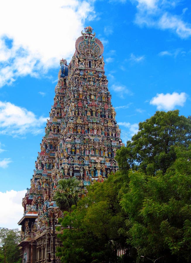 Madurai gopuram Meenakshi Amman Temple (Meenakshi Sundareswarar Temple) in India. Colored statues decorating the tall geatway towers.