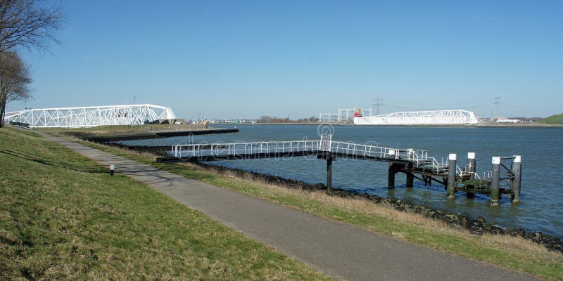 Maeslantkering in the Nieuwe Waterweg with landing stage in the front royalty free stock images Maeslantkering in the Nieuwe Waterweg with landing stage in the front royalty free stock images