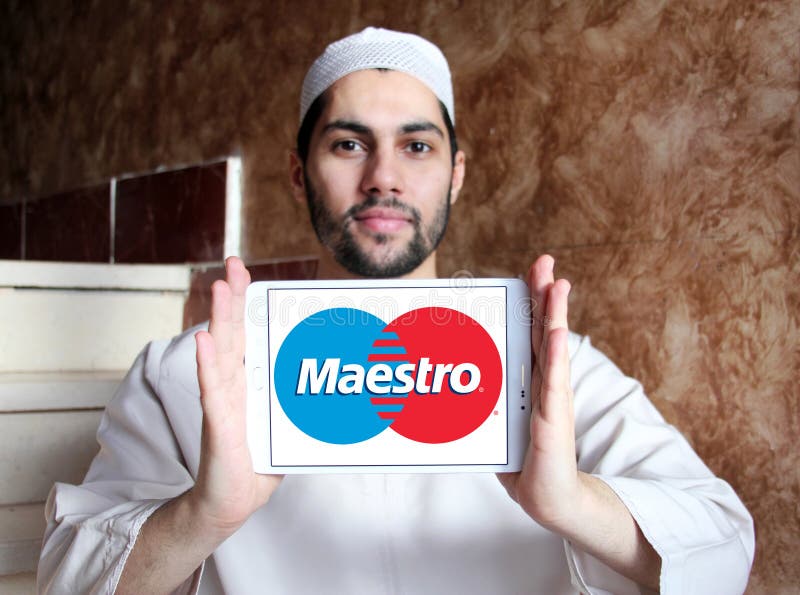 Maestro debit card logo. Logo of Maestro debit card on samsung tablet holded by arab muslim man. Maestro is a multi-national debit card service owned by royalty free stock images Maestro debit card logo. Logo of Maestro debit card on samsung tablet holded by arab muslim man. Maestro is a multi-national debit card service owned by royalty free stock images