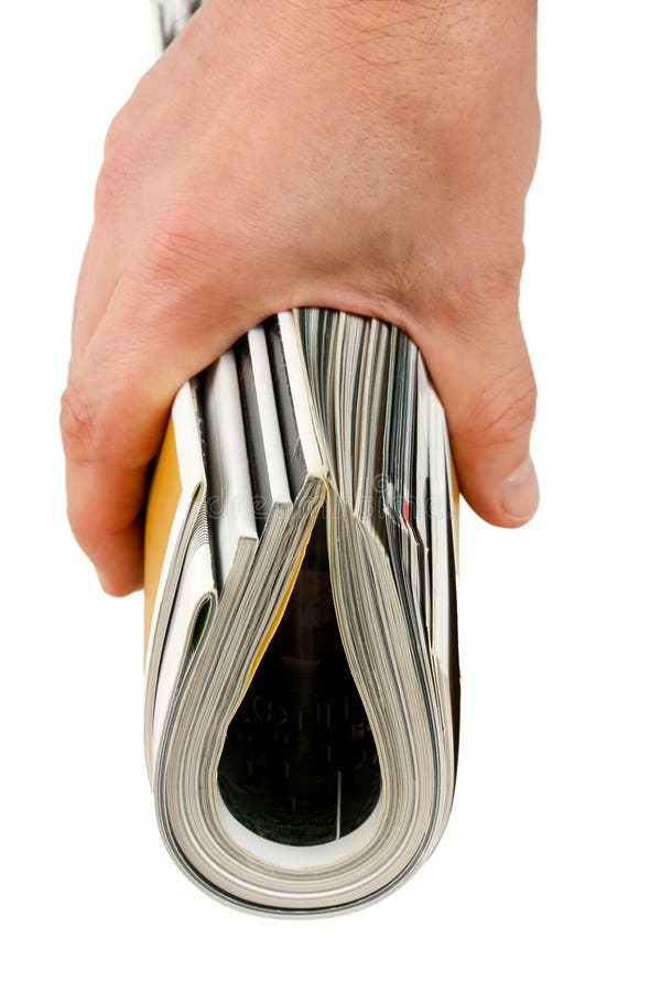 Magazine in hand stock photography