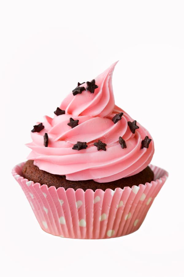 Pink cupcake decorated with chocolate stars. Pink cupcake decorated with chocolate stars