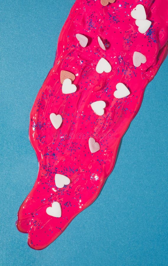 Magenta Paint with Candy Hearts on a Pastel Blue Background. Stock Image Image of fashion