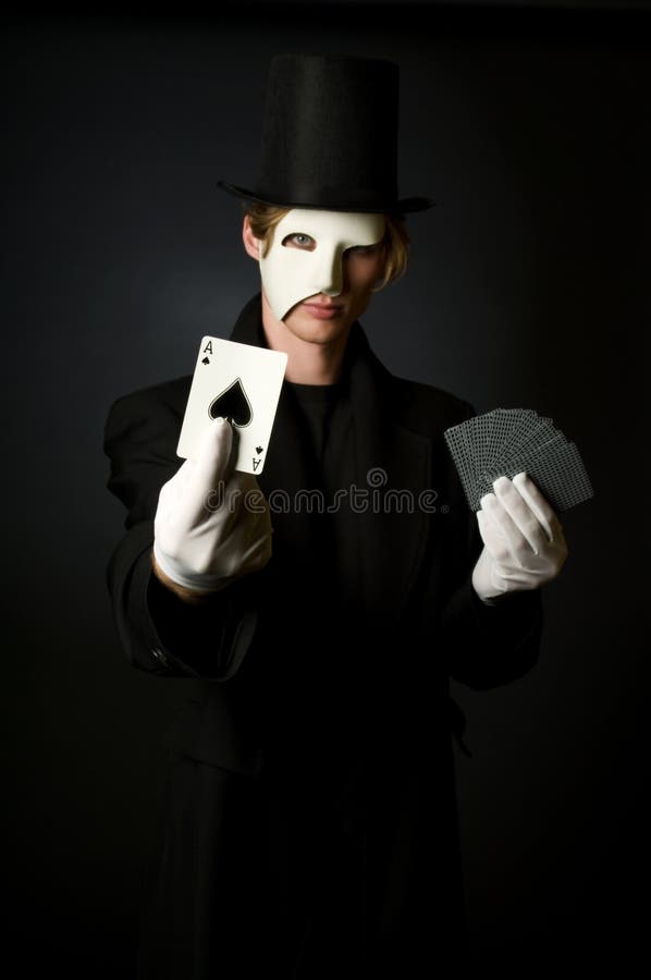 Magic Card Trick. Young male magician playing with cards Magic Card Trick. Young male magician playing with cards