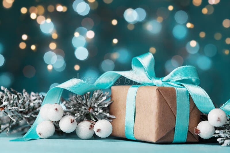 Magic christmas background with gift box and snowy fir tree. Greeting card with bokeh effect. royalty free stock photos Magic christmas background with gift box and snowy fir tree. Greeting card with bokeh effect. royalty free stock photos