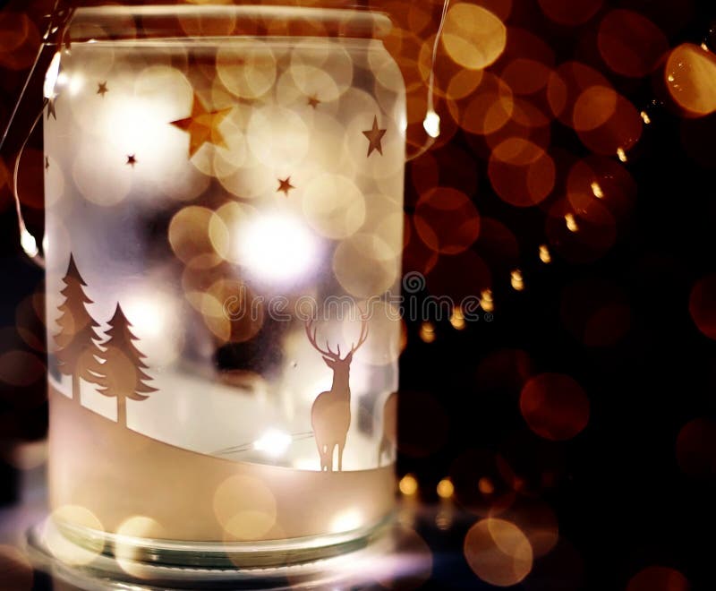 Magic luminous lantern with lights and colorful bokeh from garlands on a black background. royalty free stock image Magic luminous lantern with lights and colorful bokeh from garlands on a black background. royalty free stock image