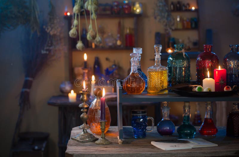 Magic Potions in Witch`s House with Burning Candles at Night Stock