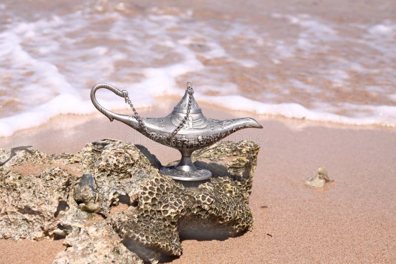 Magic silver lamp on a sea