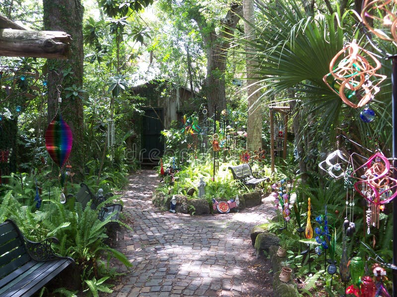 Magical garden featuring and wind chimes stock images