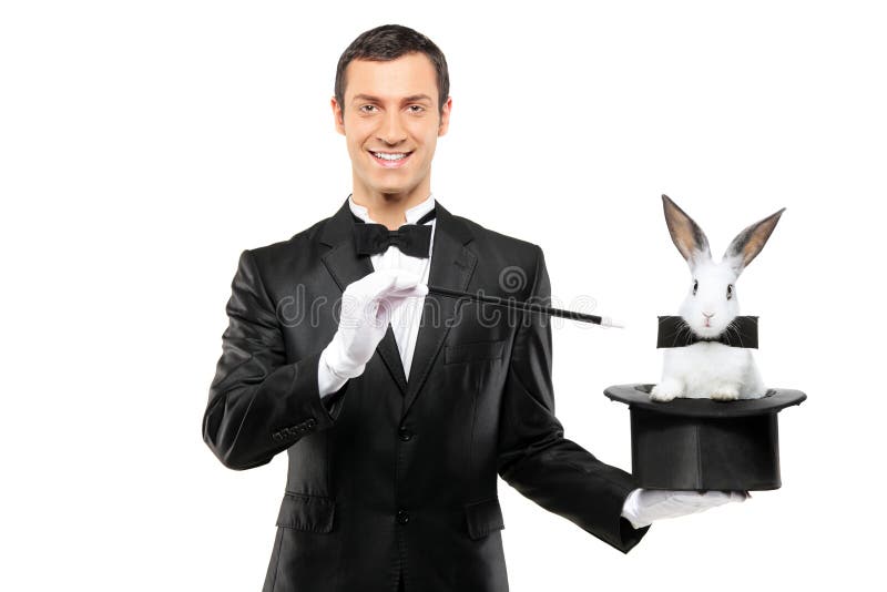 A magician holding a top hat with a rabbit in it stock photos A magician holding a top hat with a rabbit in it stock photos