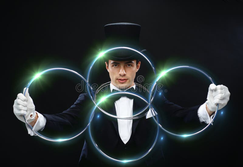 Magician showing trick with linking rings stock image Magician showing trick with linking rings stock image