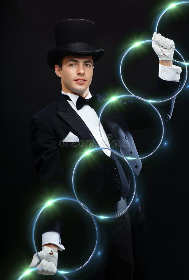 Magician showing trick with linking rings royalty free stock photography Magician showing trick with linking rings royalty free stock photography