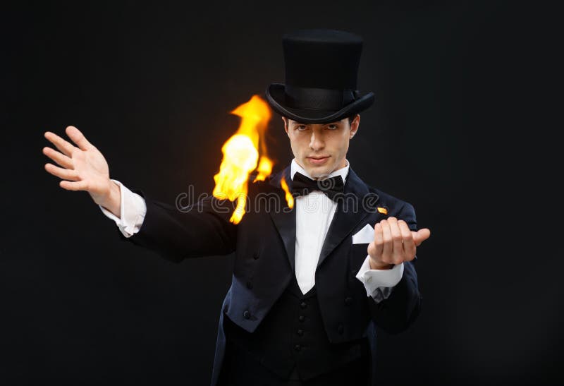 Magician in top hat showing trick with fire stock image Magician in top hat showing trick with fire stock image