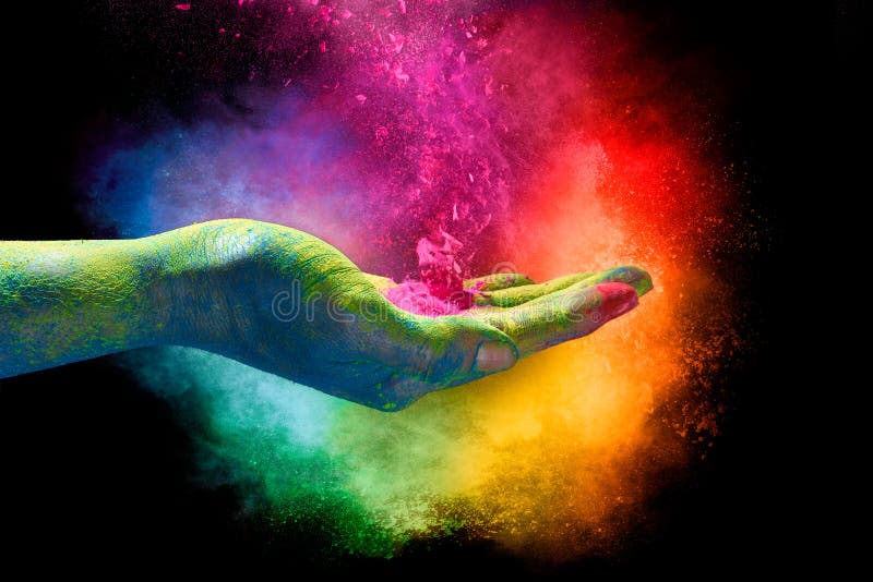 Magisch regenboog gekleurd stof die van een hand exploderen Holi Festiva