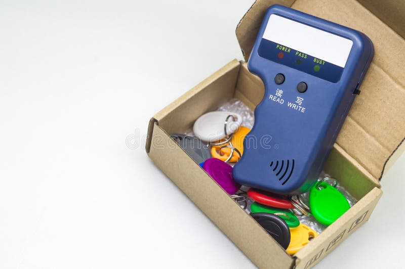 Magnetic key programmer. Duplicator for intercom keys. Electronic equipment for small businesses. Selective focus, copy stock photo