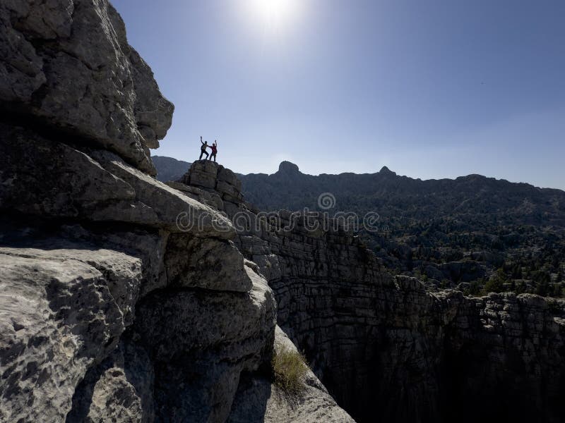 Magnificent views and dual climbers in dangerous, wild and high mountains royalty free stock photography