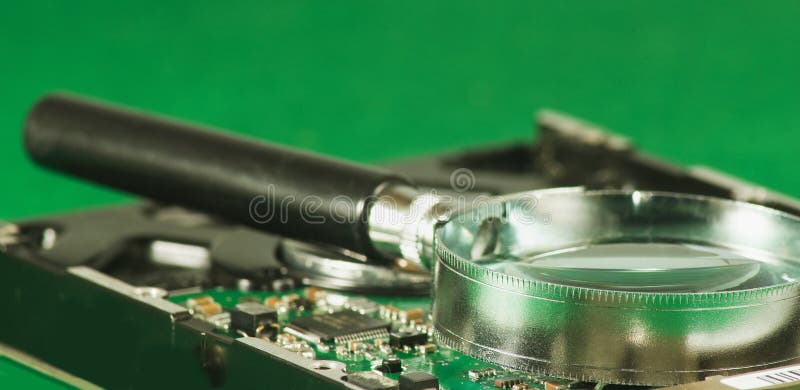 Magnifier on microchip background stock image