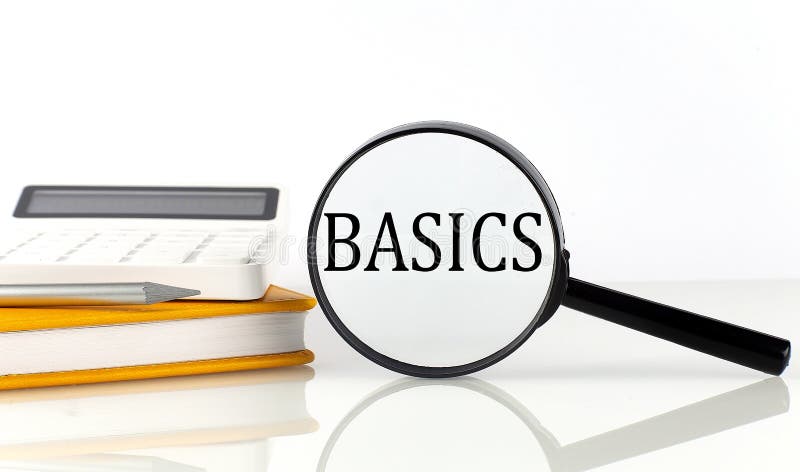 Magnifier with text BASICS with notebook, calculator on the white background royalty free stock photos
