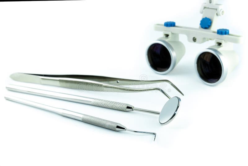 Magnifying Binocular Glasses Closeup. Dental Instruments in the Stock