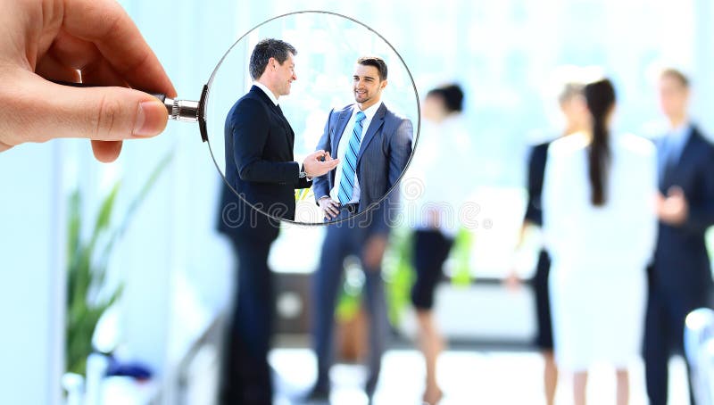 Magnifying glass and businessman